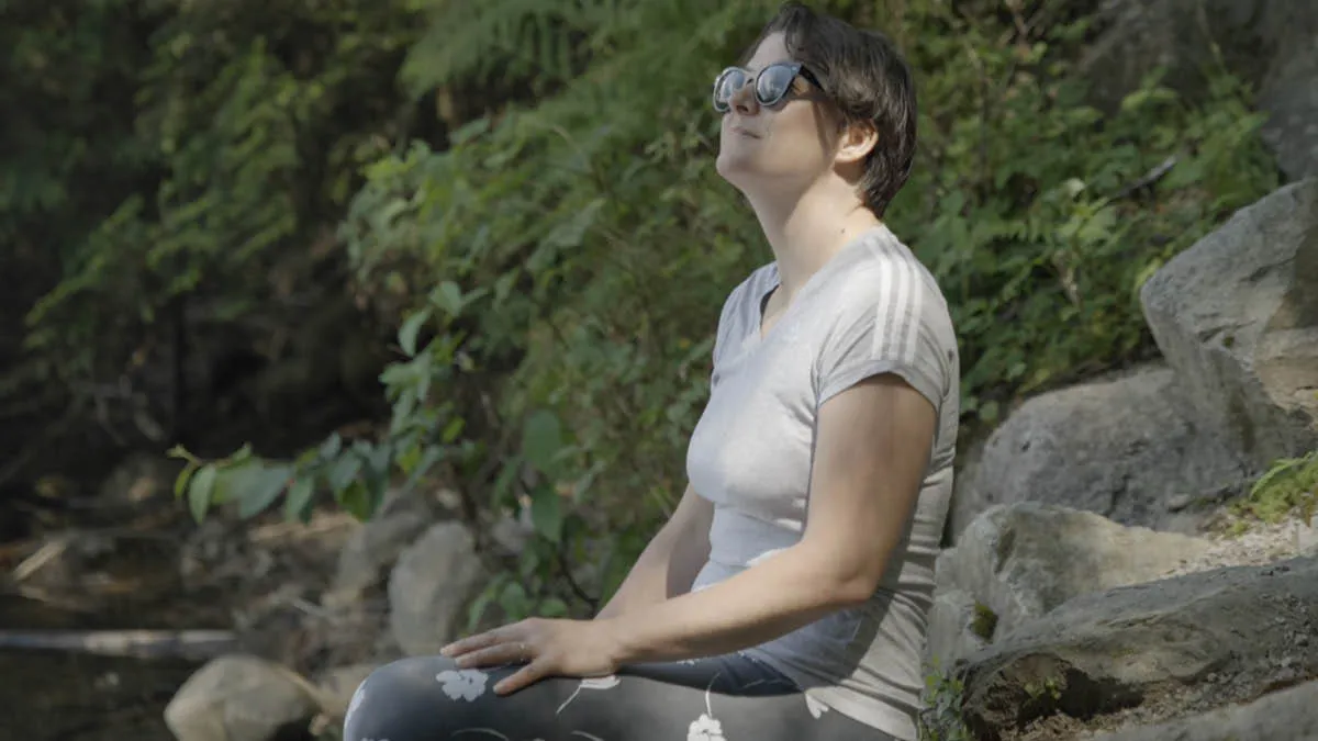 Australian expat Simone sitting quietly outdoors